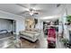 Open living space with hardwood floors and view to kitchen and staircase at 3431-0 Tioga Lake Cv, Lawrenceville, GA 30044