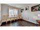 Cozy living room with natural light, dark hardwood floors, and decorative trim at 3431-0 Tioga Lake Cv, Lawrenceville, GA 30044