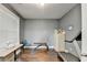 Office features a treadmill, sewing machine, hardwood floors and a large window at 3431-0 Tioga Lake Cv, Lawrenceville, GA 30044