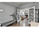 Office with french doors flowing into living area with a fireplace at 3431-0 Tioga Lake Cv, Lawrenceville, GA 30044