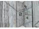 Modern shower with vertical stone-look tile, rainfall shower head, and built-in niche at 3431-0 Tioga Lake Cv, Lawrenceville, GA 30044