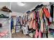 Spacious walk-in closet providing ample storage with shelving and hanging racks at 3431-0 Tioga Lake Cv, Lawrenceville, GA 30044