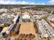 Community aerial view showing residential area, park and commercial spaces at 3930 Charleston Market St # 221, Suwanee, GA 30024