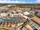 Expansive aerial view highlighting the commercial and residential development within a vibrant community setting at 3930 Charleston Market St # 221, Suwanee, GA 30024