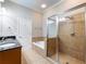 Bathroom features a soaking tub, shower, and a vanity with ample counter space at 3930 Charleston Market St # 221, Suwanee, GA 30024