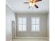 Bedroom with a ceiling fan, neutral walls, carpet flooring and plantation shutters on windows at 3930 Charleston Market St # 221, Suwanee, GA 30024