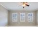 Bedroom with shuttered windows allowing natural light to illuminate the space at 3930 Charleston Market St # 221, Suwanee, GA 30024
