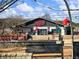 Exterior of StillFire Brewing, decorated with holiday cheer, steps and outdoor seating at 3930 Charleston Market St # 221, Suwanee, GA 30024