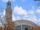 View of City Hall building exterior with clock tower and blue sky background at 3930 Charleston Market St # 221, Suwanee, GA 30024