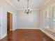 Bright dining room with hardwood floors, neutral paint and shuttered windows at 3930 Charleston Market St # 221, Suwanee, GA 30024