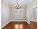 Dining room features hardwood floors, neutral paint and a chandelier at 3930 Charleston Market St # 221, Suwanee, GA 30024