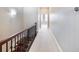 Hallway with decorative lighting and carpet flooring leads to rooms with lots of natural light at 3930 Charleston Market St # 221, Suwanee, GA 30024