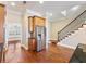Modern kitchen with stainless steel appliances, granite countertops and light wood cabinetry at 3930 Charleston Market St # 221, Suwanee, GA 30024