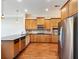 Modern kitchen with stainless steel appliances and light wood cabinetry at 3930 Charleston Market St # 221, Suwanee, GA 30024
