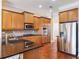 Gourmet kitchen with stainless steel appliances, granite countertops, and custom wood cabinetry at 3930 Charleston Market St # 221, Suwanee, GA 30024