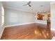 Bright living room boasts hardwood floors and connects to a kitchen with stainless steel appliances at 3930 Charleston Market St # 221, Suwanee, GA 30024