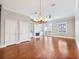 Bright and spacious living room with hardwood floors, a fireplace, and built-in shelving at 3930 Charleston Market St # 221, Suwanee, GA 30024