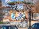 Artistic brick mural with covered shelter and landscaping in a park setting at 3930 Charleston Market St # 221, Suwanee, GA 30024