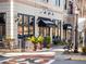 Ippolito's Italian Restaurant with outdoor seating and black awnings in a charming building at 3930 Charleston Market St # 221, Suwanee, GA 30024