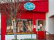 Brightly colored Tequila Mama Taqueria exterior with vibrant signage, outdoor greenery, and inviting entrance at 3930 Charleston Market St # 221, Suwanee, GA 30024