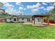 Expansive backyard with patio cover and wooden fence, perfect for entertaining at 425 Charlyne Way, Dacula, GA 30019