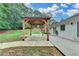 Exterior shot of wooden gazebo featuring a brick patio and a private backyard at 425 Charlyne Way, Dacula, GA 30019