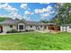 Large backyard featuring a covered patio, shed, and well-maintained lawn at 425 Charlyne Way, Dacula, GA 30019