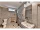 Accessible bathroom featuring grab bars, roll-in shower with bench and modern fixtures at 425 Charlyne Way, Dacula, GA 30019