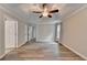 Spacious bedroom featuring new hardwood floors, ceiling fan and neutral walls at 425 Charlyne Way, Dacula, GA 30019