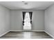 Modern bedroom featuring natural light, neutral walls, and durable vinyl flooring at 425 Charlyne Way, Dacula, GA 30019
