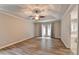 Spacious main bedroom with tray ceiling, vinyl floors and access to a private bathroom and backyard at 425 Charlyne Way, Dacula, GA 30019