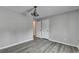 Neutral bedroom featuring natural light, modern ceiling fan, and vinyl flooring for easy maintenance at 425 Charlyne Way, Dacula, GA 30019