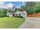 Charming single-story home with a well-maintained lawn, driveway and mature trees at 425 Charlyne Way, Dacula, GA 30019