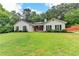 Charming single-story home with a well-maintained lawn and mature trees at 425 Charlyne Way, Dacula, GA 30019