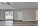 Bright living room featuring hardwood floors, a window and neutral paint at 425 Charlyne Way, Dacula, GA 30019