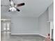 Open living room featuring hardwood floors, neutral paint, fireplace and double french doors at 425 Charlyne Way, Dacula, GA 30019