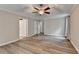 Spacious main bedroom with tray ceiling, vinyl floors and access to a private bathroom at 425 Charlyne Way, Dacula, GA 30019