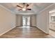 Spacious main bedroom with tray ceiling, vinyl floors and access to a private bathroom and backyard at 425 Charlyne Way, Dacula, GA 30019
