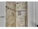 Updated tile shower with modern fixtures, grab bars, and tiled niche at 425 Charlyne Way, Dacula, GA 30019