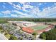 Aerial shot of the football field at Denmark High School, showcasing a beautiful campus with a track and sports field at 5686 Lawley Dr, Alpharetta, GA 30022