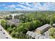 Aerial view of townhomes with mature trees and landscaping at 5686 Lawley Dr, Alpharetta, GA 30022