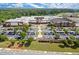 Vibrant aerial view of a large school with extensive parking and athletic fields surrounded by lush greenery at 5686 Lawley Dr, Alpharetta, GA 30022