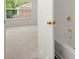 Modern bathroom with a tub and a view to a bright, carpeted bedroom at 5686 Lawley Dr, Alpharetta, GA 30022