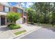 Attractive brick townhome with a single-car garage, featuring well-maintained landscaping and a cozy entrance at 5686 Lawley Dr, Alpharetta, GA 30022