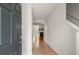 Bright foyer with hardwood floors leading to the living areas and staircase at 5686 Lawley Dr, Alpharetta, GA 30022
