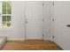 Foyer with hardwood floors and a white interior door at 5686 Lawley Dr, Alpharetta, GA 30022