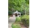 Charming gazebo nestled in a wooded area with a paved walkway at 5686 Lawley Dr, Alpharetta, GA 30022
