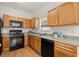 Well-lit kitchen with modern appliances and spacious countertops at 5686 Lawley Dr, Alpharetta, GA 30022