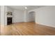 Bright living room with hardwood floors and a fireplace with white molding at 5686 Lawley Dr, Alpharetta, GA 30022