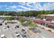 Charming retail shops with accessible parking, shaded walkways, and visible storefronts in a shopping plaza at 5686 Lawley Dr, Alpharetta, GA 30022